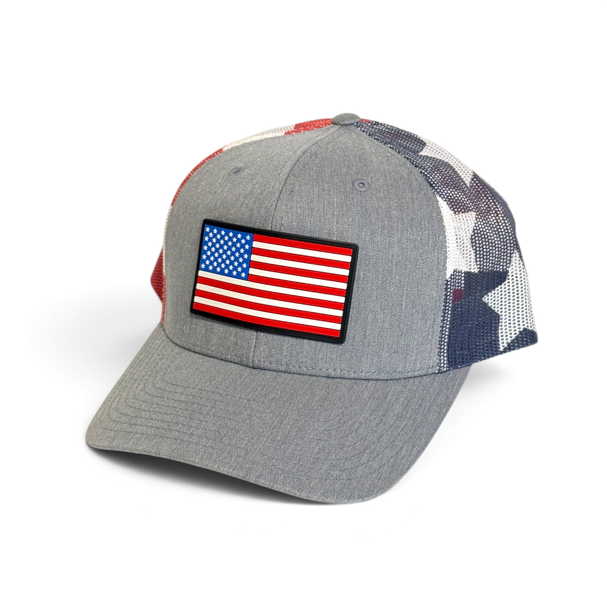 Crafted Merch grey trucker hat with a full-color American flag PVC patch and patriotic star-patterned mesh back