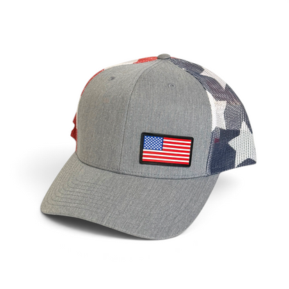 Crafted Merch grey trucker hat featuring a full-color American flag PVC patch and a patriotic star-patterned mesh back