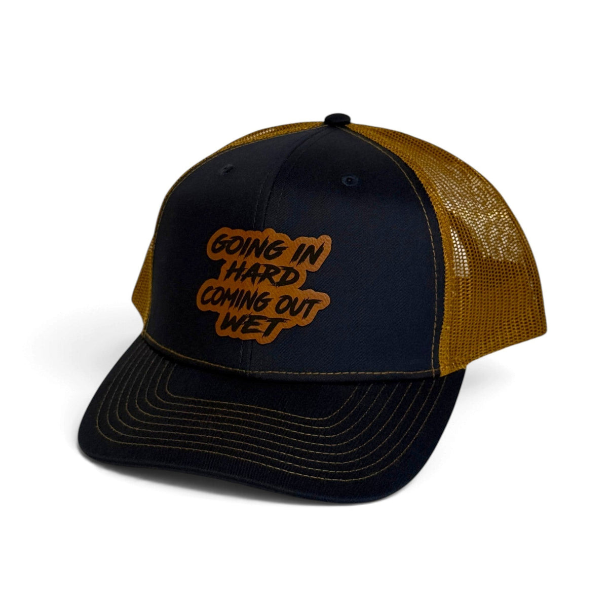 Crafted Merch trucker hat in black and brown with a front patch featuring the text Going In Hard Coming Out Wet