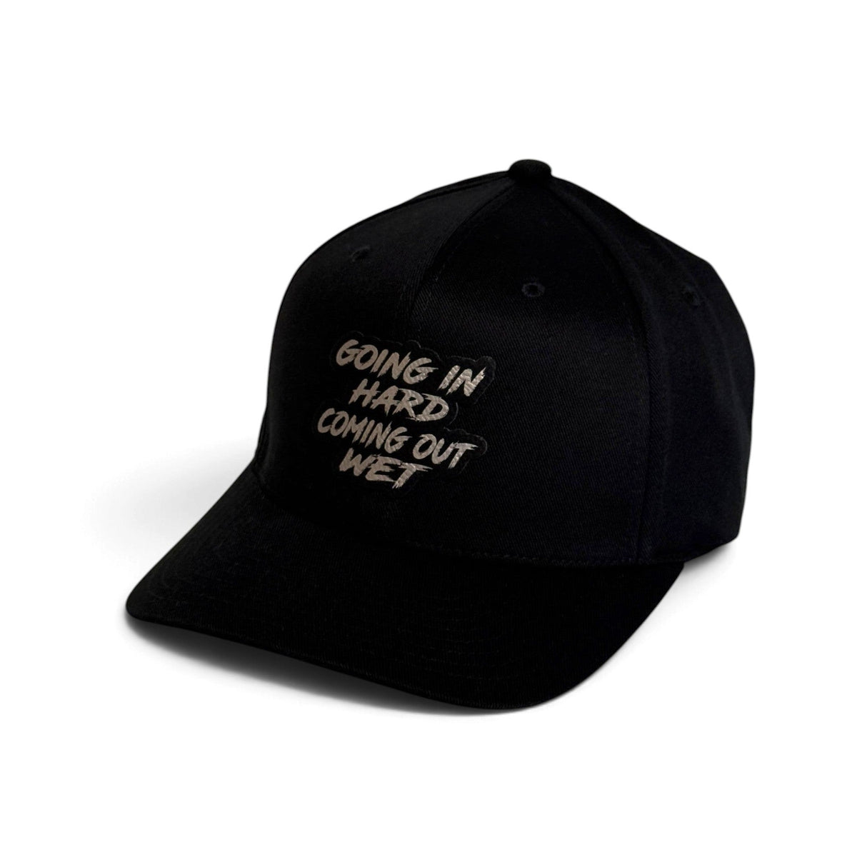 Crafted Merch black trucker hat featuring a patch with the text Going In Hard Coming Out Wet on the front panel