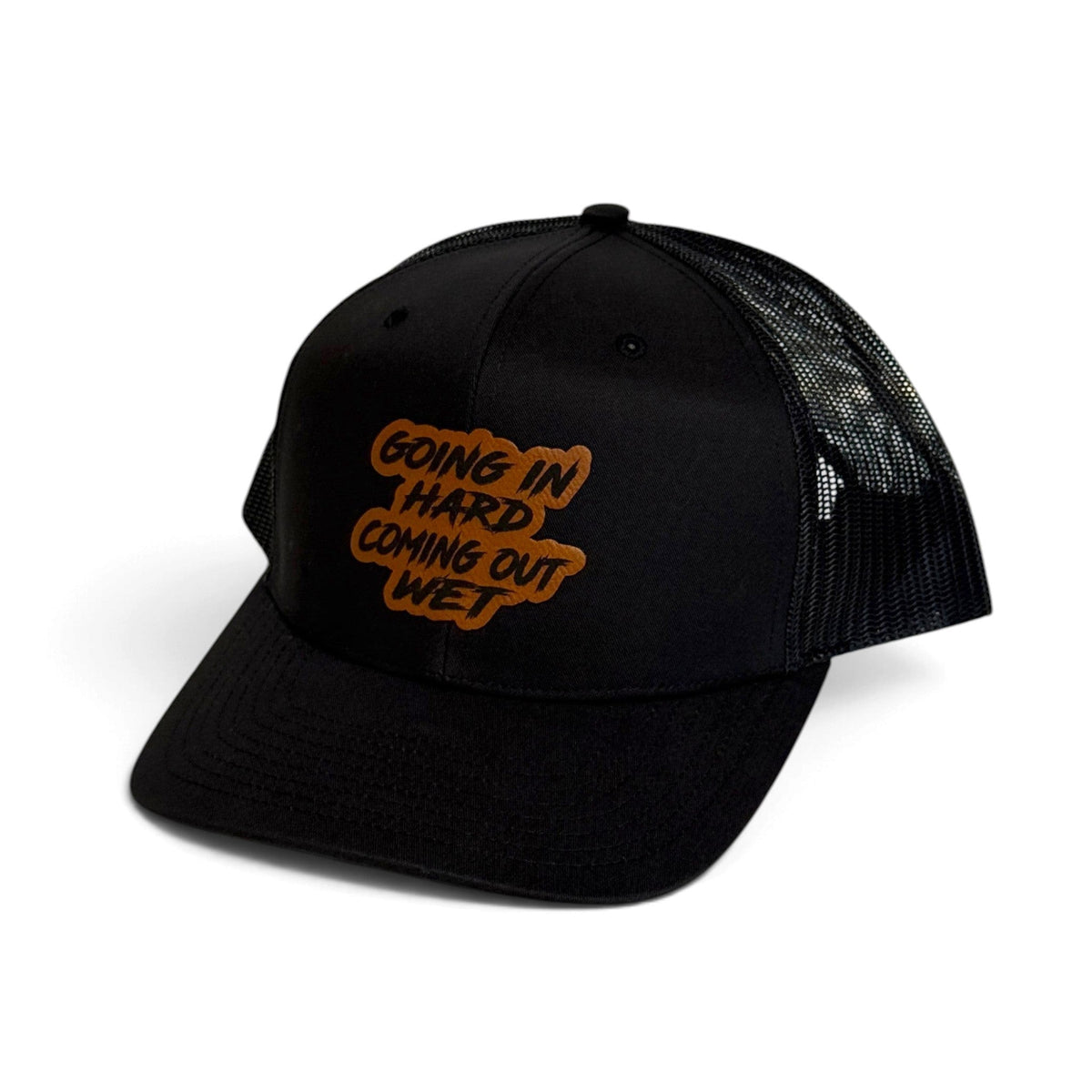 Crafted Merch black trucker hat with a brown embroidered patch featuring the text Going In Hard Coming Out Wet