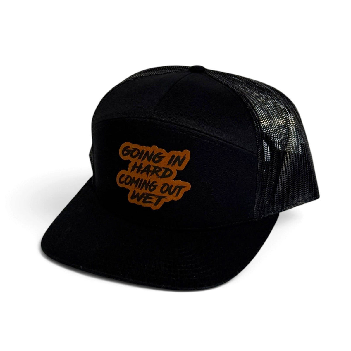 Crafted Merch black trucker hat with a brown patch featuring the text Going In Hard Coming Out Wet