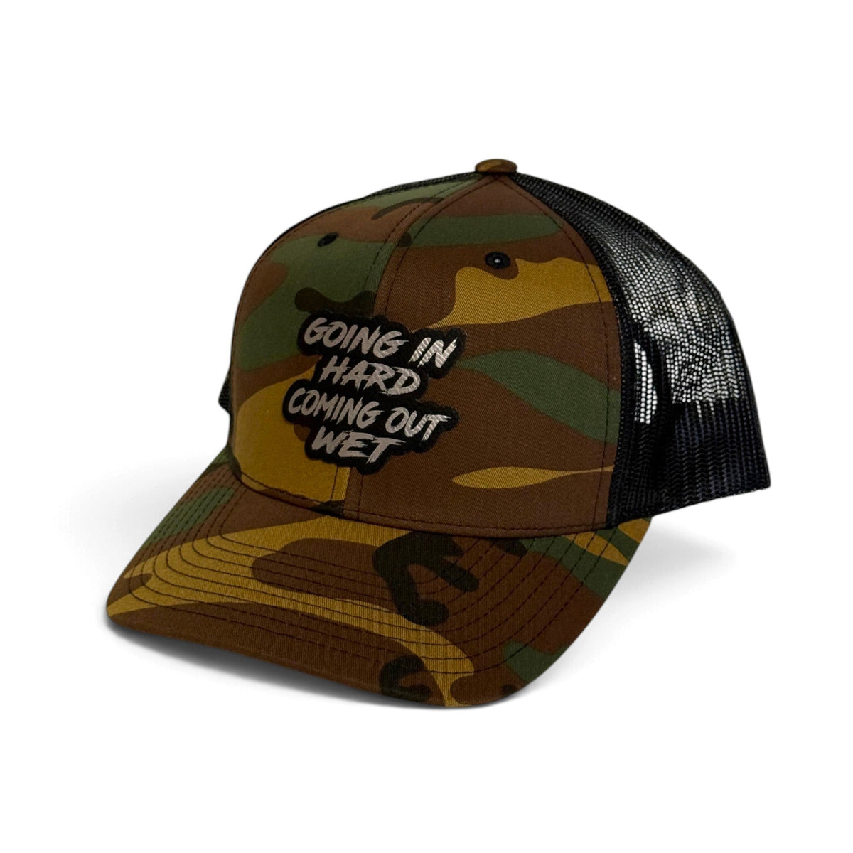 Crafted Merch trucker hat in camouflage print with a black mesh back and a graphic patch on the front panel.
