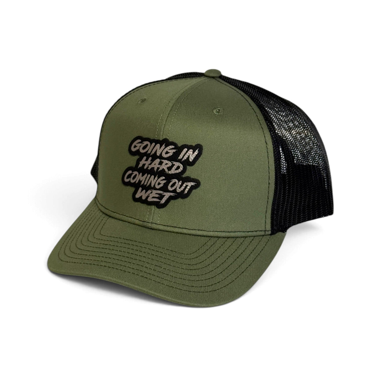 Crafted Merch olive green trucker hat with a black mesh back and a patch featuring the text Going In Hard Coming Out Wet
